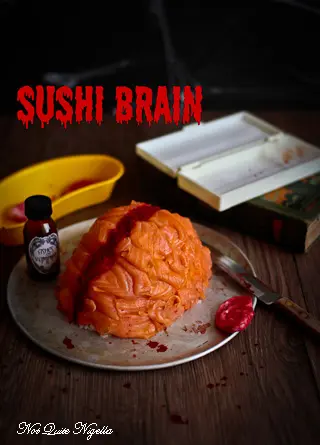 Halloween sushi brain covered with smoked salmon and red caviar