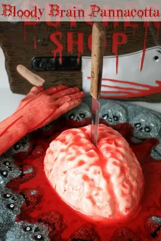 Brain-shaped panna cotta covered in blood-red jelly sauce