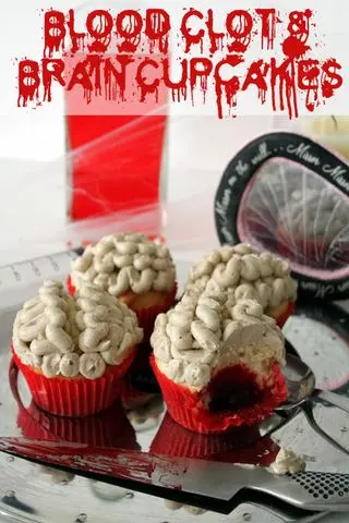 Brain cupcakes with pink buttercream squiggles and strawberry jam centres