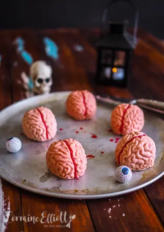 Pink chocolate brain truffles filled with peanut butter and dried cranberries
