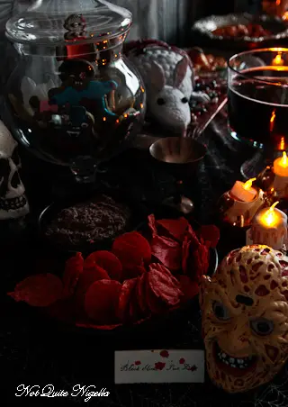 Halloween black bean slime dip with green herb oil